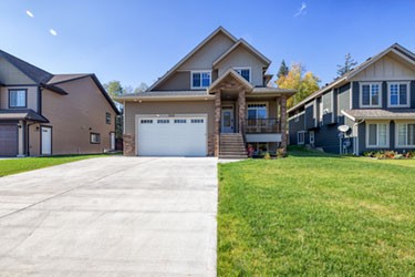 tan house with long driveway