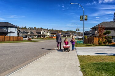 young family walking the neighbourhood